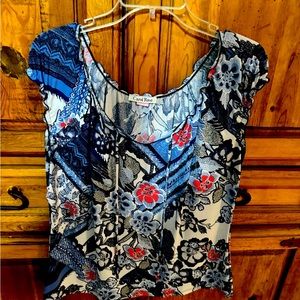 Blue print with red accents in flower prints.